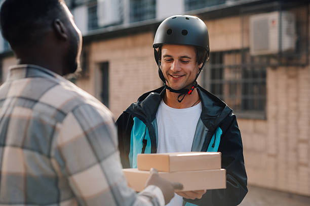 istock Courier delivering packages to customer in the city 2225454663
