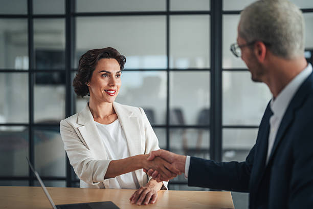 istock Successful business agreement sealed with a handshake in modern office 2225456695