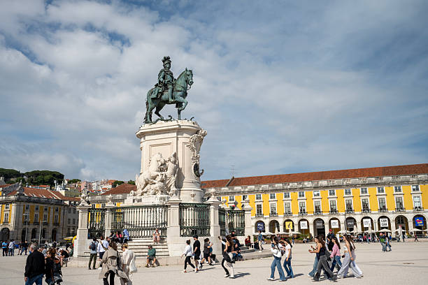 Lisbon, Portugal - May 7, 2025. Tourists walking around Equestrian Monument of King Jose at Commerce Square in Lisbon, Portugal