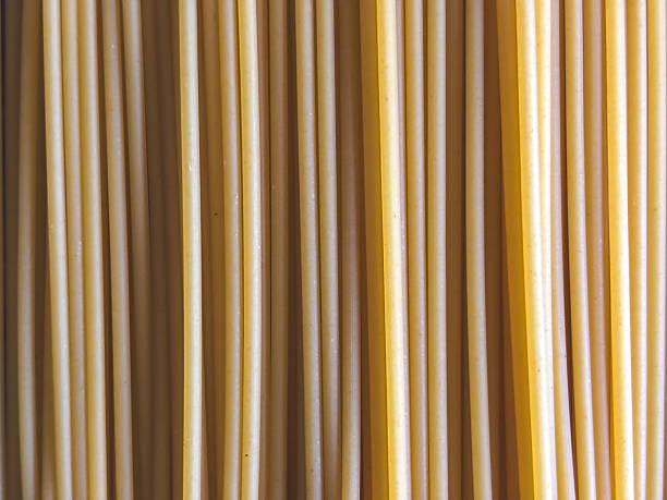 Abstract Vertical Lines Created by a Close-Up of Uncooked Bucatini Pasta