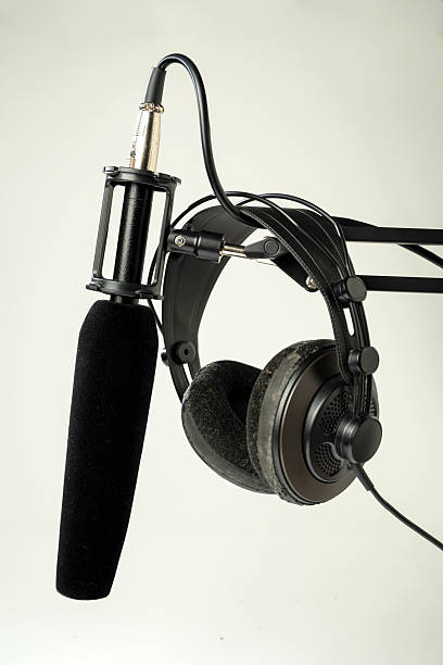 istock Studio microphone for podcasting or streaming on a boom arm with headphones on a white background 2225471516