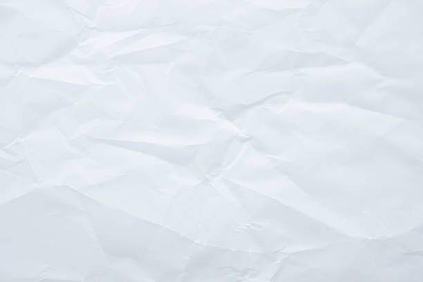 istock Abstract white crumpled and creased recycle paper texture background 2225472275