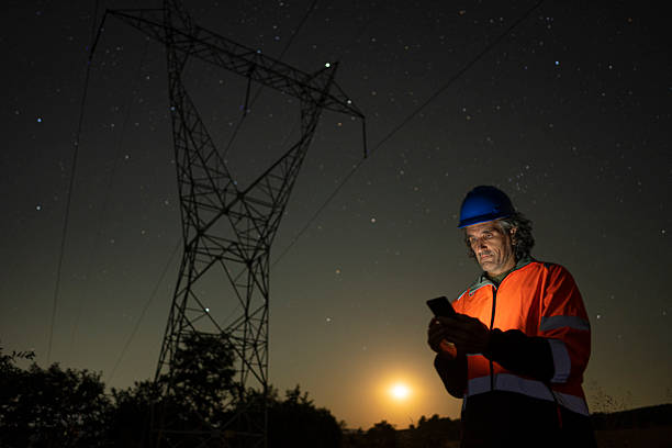 istock High Voltage Engineer Working Late At Night. Sustainable Energy 2225472373