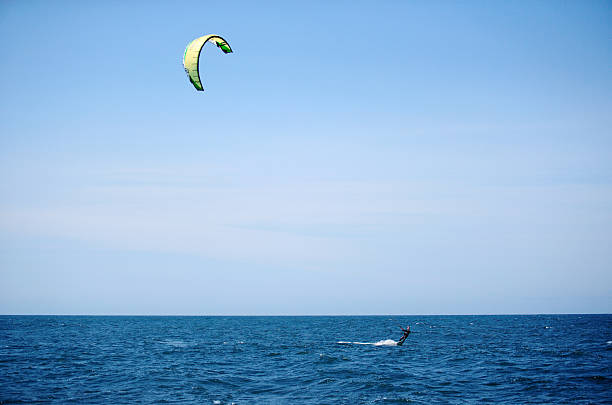 Florence, Oregon, USA - May 28, 2007: A wind surfer or kite surfer, surfing on choppy water on the Pacific ocean