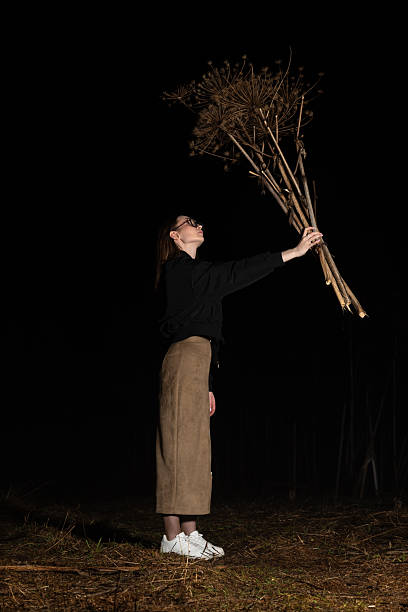 Woman hold dry hogweed