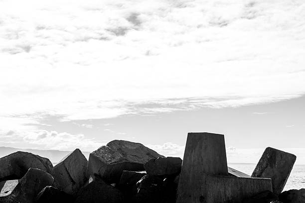 Black and white closeup old weathered concrete blocks, abstract background with copy space, full frame horizontal composition