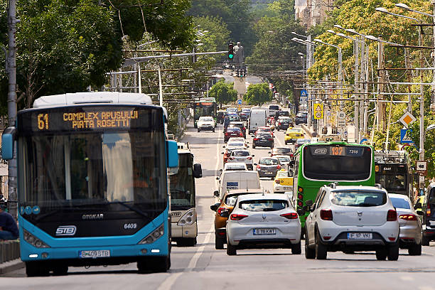 Bucharest, Romania. 11th July, 2025: Bucharest Transport Society trolleybuses and buses are in traffic on Regina Elisabeta Boulevard in Bucharest.