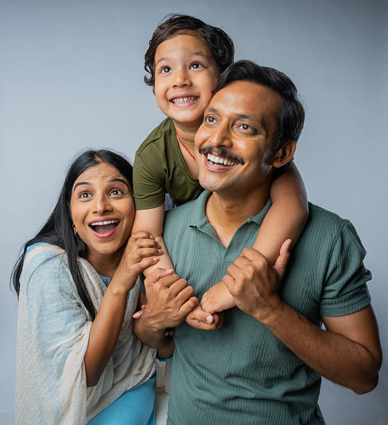istock Family enjoying leisure time on white background 2225494079