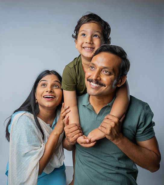 istock Family enjoying leisure time on white background 2225494113