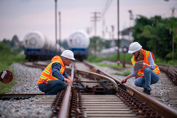 istock Engineer railway engaged in discussion or inspection maintenance work greenery and gas or oil power industrial or transportation setting in the rail train import export logistics industry concept 2225494149