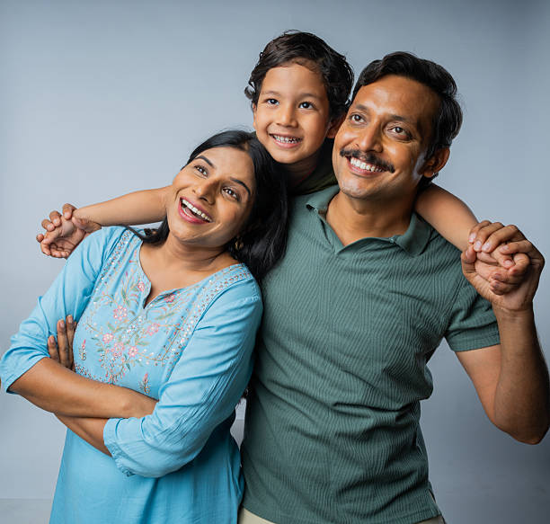 istock Family enjoying leisure time on white background 2225495771