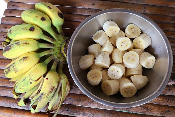 istock Peeling and cutting Banana - fruit preparation. 2225498105
