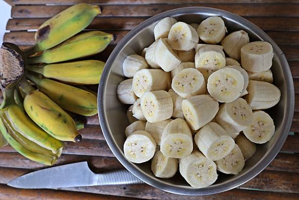 istock Peeling and cutting Banana - fruit preparation. 2225498148