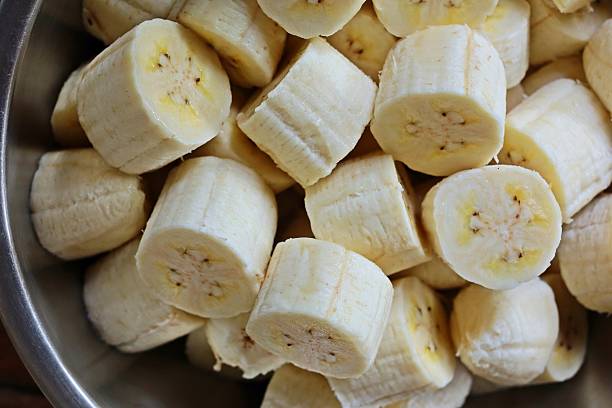 istock Peeling and cutting Banana - fruit preparation. 2225498174