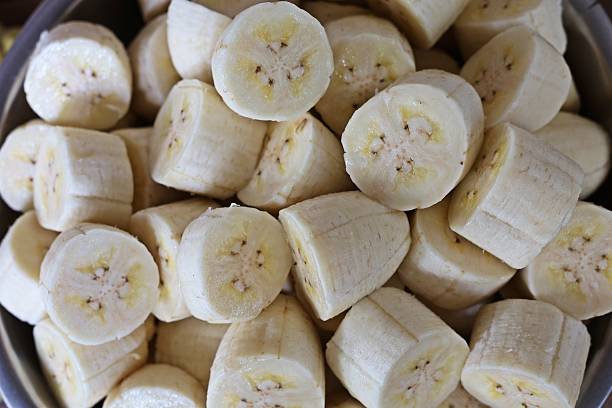 istock Peeling and cutting Banana - fruit preparation. 2225498206