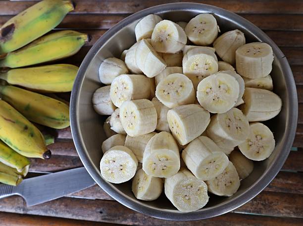 istock Peeling and cutting Banana - fruit preparation. 2225498207