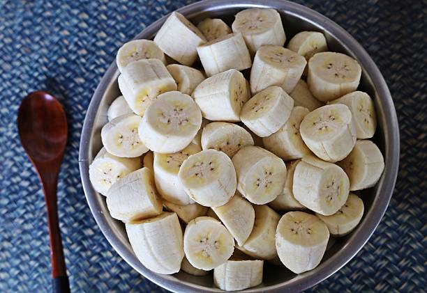 istock Peeling and cutting Banana - fruit preparation. 2225498257