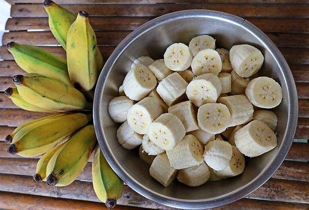 istock Peeling and cutting Banana - fruit preparation. 2225498289