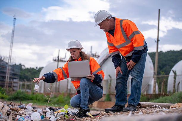 istock Environmental engineer or workers examining waste water along a  large industrial waste water or pollution monitoring and maintenance to ensure systems operate effective environmental regulations. 2225498485