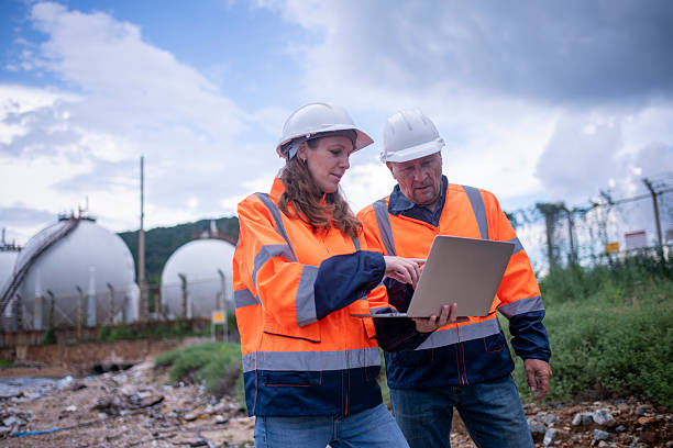 istock Environmental engineer or workers examining waste water along a  large industrial waste water or pollution monitoring and maintenance to ensure systems operate effective environmental regulations. 2225498850