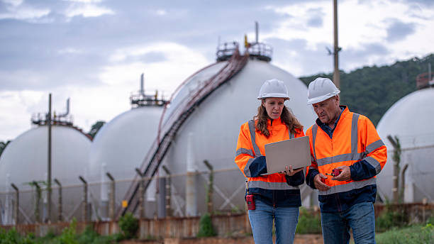 istock Environmental engineer or workers examining waste water along a  large industrial waste water or pollution monitoring and maintenance to ensure systems operate effective environmental regulations. 2225498874