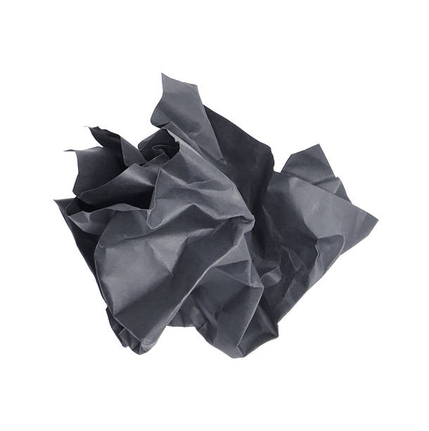 istock Crumpled black paper ball isolated on white background 2225500505