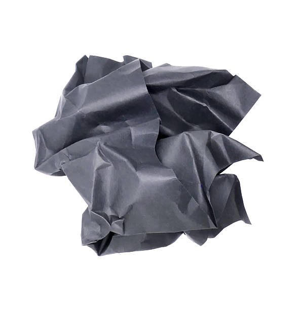 istock Crumpled black paper ball isolated on white background 2225500508