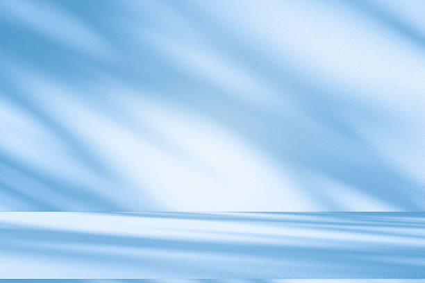 istock Studio style background wall decoration presentation uses white and blue tones. with shadows cast from a nearby window, concept creating a decorative 2225501913