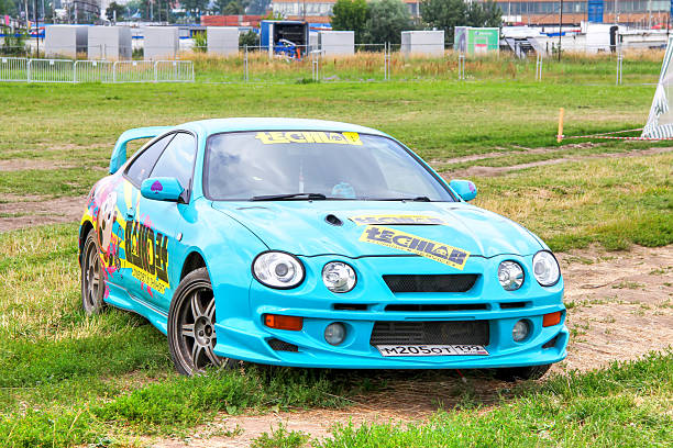 Drag racing car burns rubber off its tires in preparation for the race