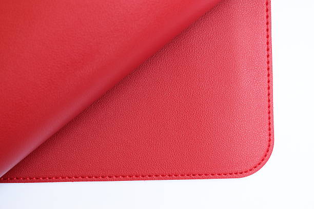 istock shiny red leather texture isolated on white background 2225504090