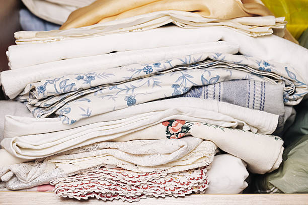 istock Stack of neatly folded fabric and linens background. Pile of textiles in wardrobe. Mixed patterns and textures. 2225508951