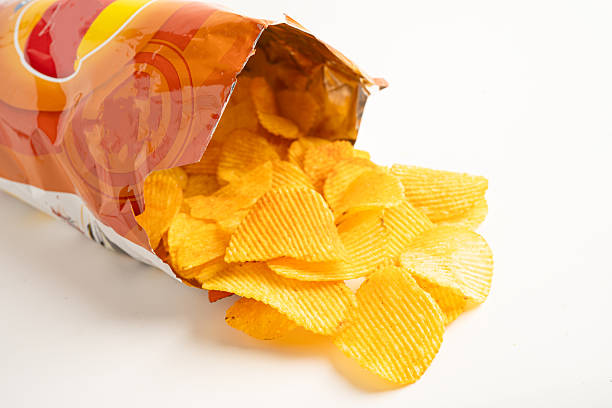 istock Potato chips deep fried snack fast food in open bag. 2225509574