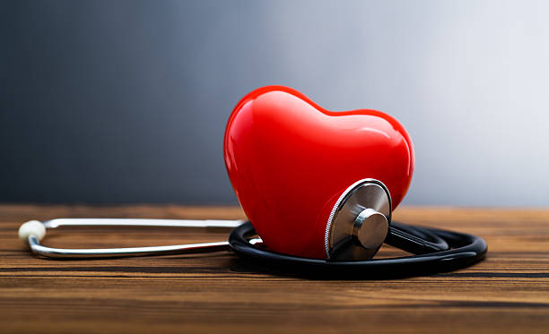 istock Red heart and stethoscope on wooden table 2225510226