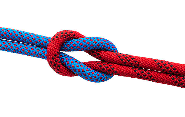 istock Red and blue ropes with reef knot isolated on white background 2225510430