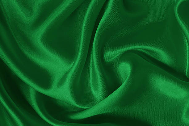 istock Green emerald fabric texture background, detail of silk or linen pattern. 2225510789