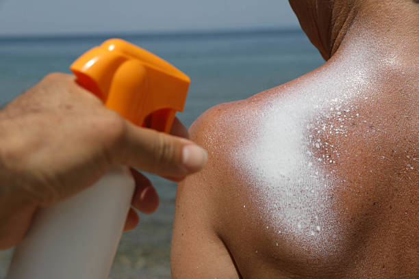 istock Close-Up of Sun Protection Routine with Sunscreen Spray 2225530058