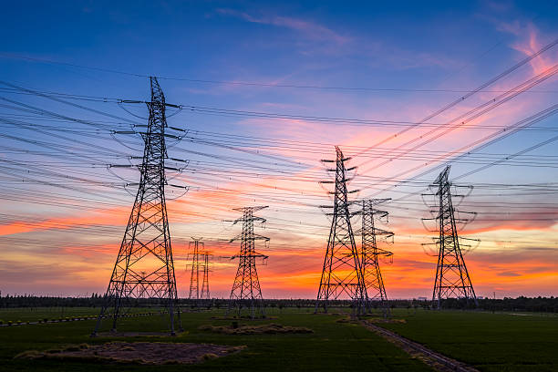 istock High voltage power tower and transmission lines with beautiful sky clouds at sunset 2225531278