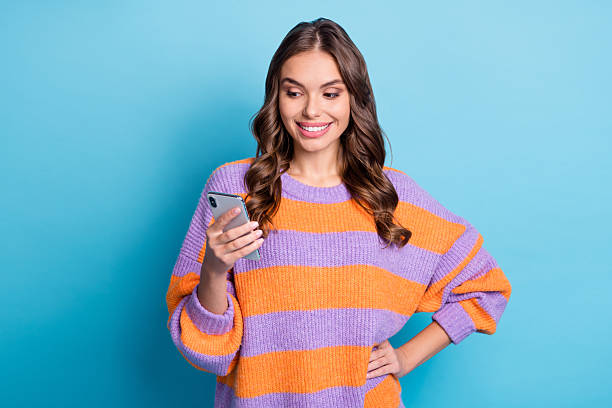 istock Portrait of attractive cheerful girl using gadget device web comment isolated over bright blue color background 2225532414