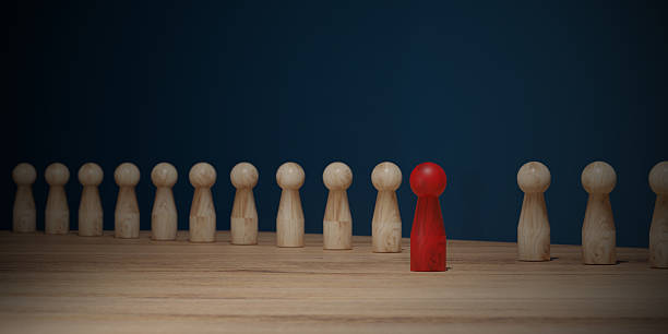 istock Red wood that is different from other black woods. The concept of difference. 2225533921