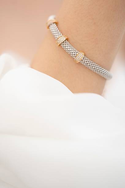 istock Elegant silver and gold bracelet close-up 2225534538