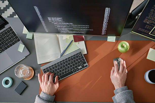 Caucasian Young Adult Man Working on Computer Programming at Modern Desk