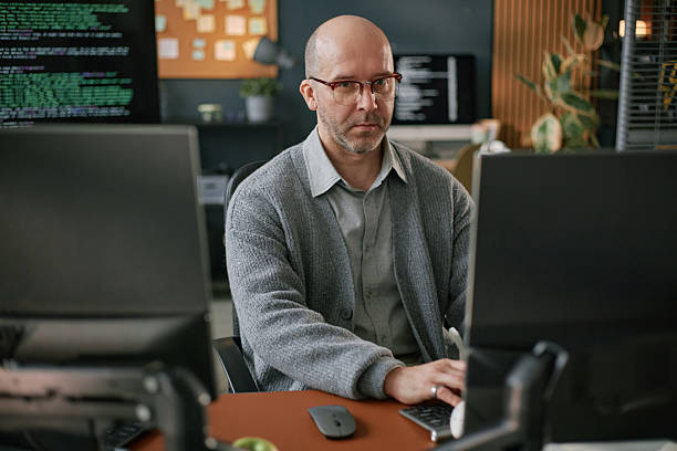 istock Portrait of Middle Aged Caucasian Man Focusing on Software Development Task 2225534976