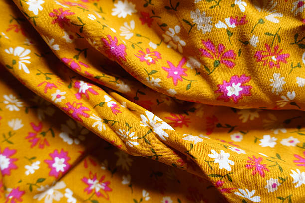 istock Background - draped mustard yellow, white and pink fabric 2225536808