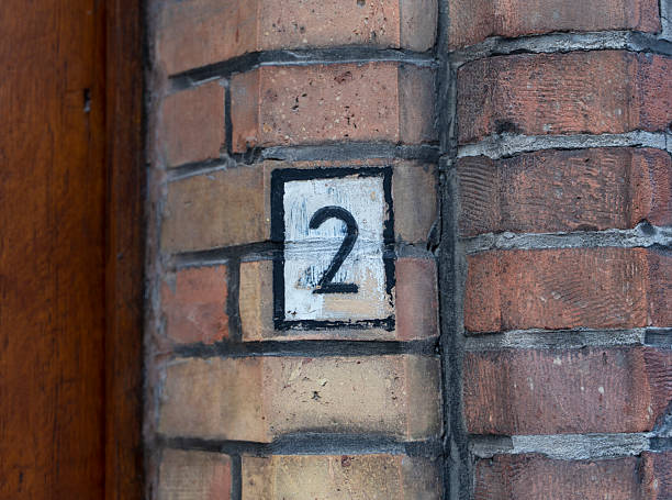 istock Number 2 painted on the brick wall 2225537096