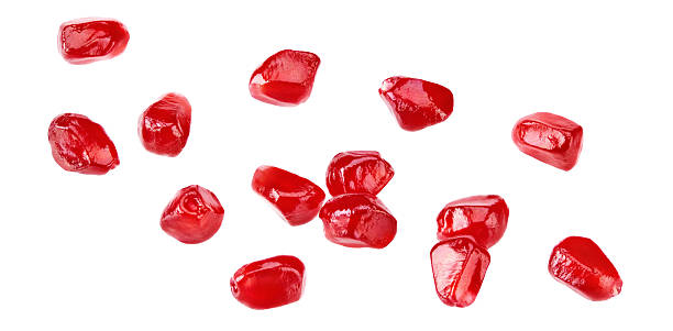 istock pomegranate seeds isolated on a white background. clipping path 2225538463