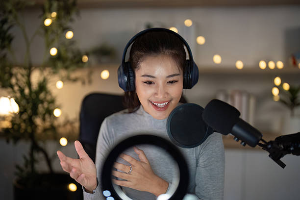 istock Podcast Host Expressing Enthusiasm in Home Studio 2225540246
