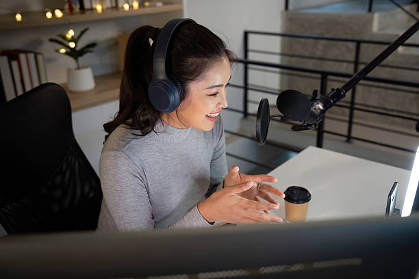 istock Podcast host recording engaging content with enthusiasm 2225540465