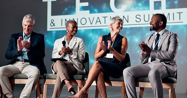 istock Clapping hands, seminar and group of speakers on stage for tech and innovation summit for investment. Applause, presentation and team of entrepreneurs with business ideas for investors at conference. 2225548359