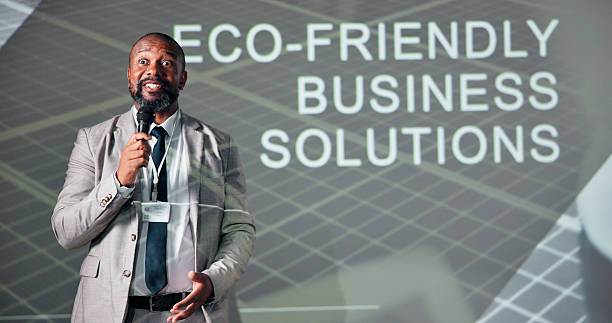 istock Business, black man and seminar for climate change, presentation and microphone with speaker. Public speaking, motivation and eco friendly conference for solution, idea pitch and education forum 2225548452