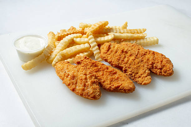 istock chicken tenders, fries 2225549042